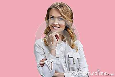 Protrait of a young blonde businesswoman touching her chin. Stock Photo