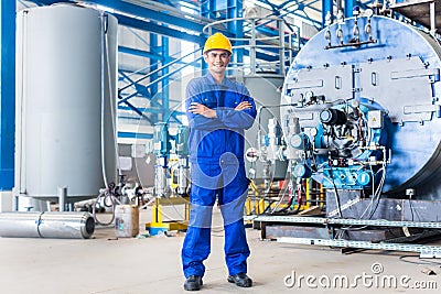 Proud Asian worker in production factory Stock Photo