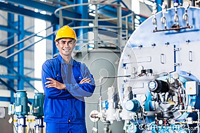 Proud Asian worker in production factory Stock Photo