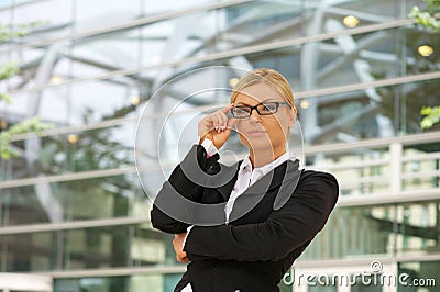 Proud business woman standing in the city Stock Photo