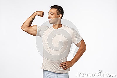 Proud and confident, self-accepting young male athlete, lead active and healthy lifestyle, in good shape, showing Stock Photo