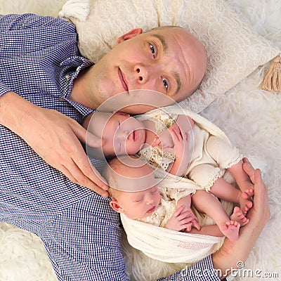 Proud daddy of newborn twins Stock Photo