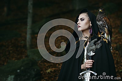Proud female warrior with hawk Stock Photo