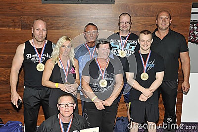 Proud male and female contestants showing their medals and trophy Editorial Stock Photo