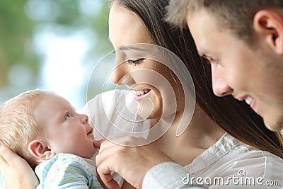 Proud parents holding their baby Stock Photo