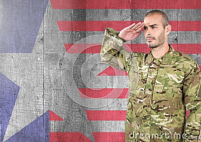 Proud soldier saluting against american flag background Stock Photo