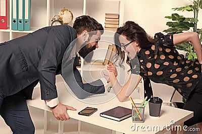 Prove how strong you are. Business partners get into armwrestling competition. Colleagues in competitive relations Stock Photo