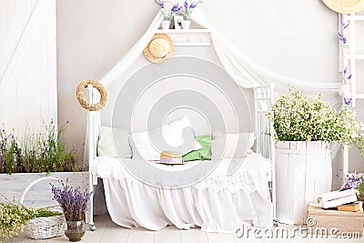 Provence style, rustic style! Shabby chic interior girly Provencal-style bedroom. Vintage room interior with white wrought-iron be Stock Photo