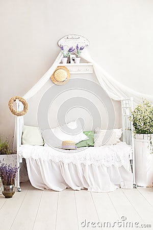 Provence style, rustic style! Shabby chic interior girly Provencal-style bedroom. Vintage room interior with white wrought-iron be Stock Photo