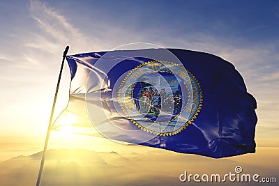 Providence city capital of Rhode Island of United States flag textile cloth fabric waving on the top sunrise mist fog Stock Photo