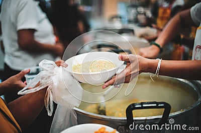 Providing food to the poor and helping with food , concept serving free food to the poor Stock Photo