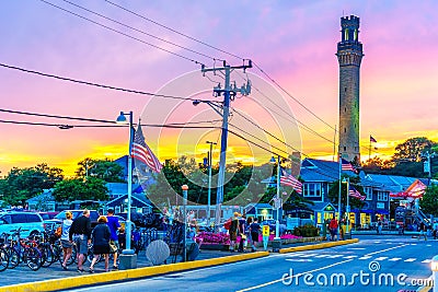 Provincetown, MA, USA - August 12 2017: Bicycle, Pilgrim Monument in the Provincetown Marina during sunset Editorial Stock Photo