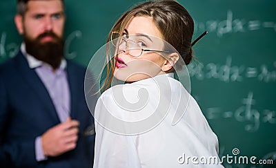 Provocation concept. Private lesson. Flirting with teacher. Student sensual sexy girl and experienced teacher. Teaching Stock Photo