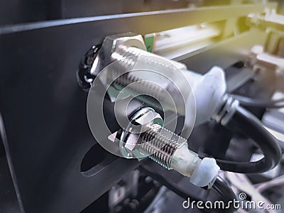 Proximity Sensor on Machine to Detect Moving Metal Parts Stock Photo