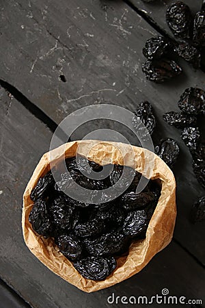 Prunes on a dark table, food background Stock Photo