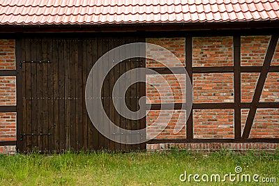 Prussian wall and wooden gate. Stock Photo
