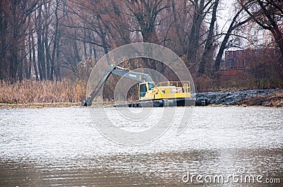 Pryluky, Chernihiv / Ukraine - 11/19/2020: Amphibious Excavators. River Cleaning Editorial Stock Photo