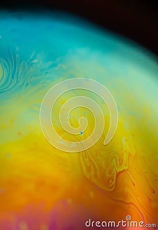 Psychedelic abstract planet from soap bubble, Light refraction on a soap bubble, Macro Close Up moving particles Rainbow colors on Stock Photo