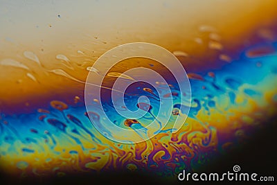 Psychedelic abstract planet from soap bubble, Light refraction on a soap bubble, Macro Close Up moving particles Rainbow colors on Stock Photo