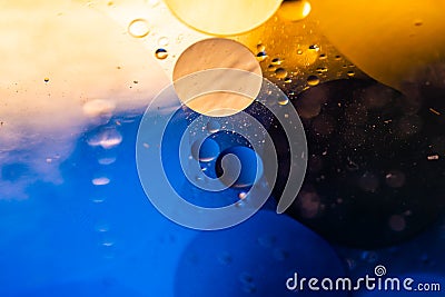 Psychedelic blueand yellow oil and water abstract background. Abstract colorful background. Foam of Soap with Bubbles macro shot. Stock Photo