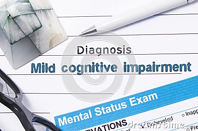 Psychiatric Diagnosis Mild Cognitive Impairment. Medical book or form with the name of diagnosis Mild Cognitive Impairment is on t Stock Photo