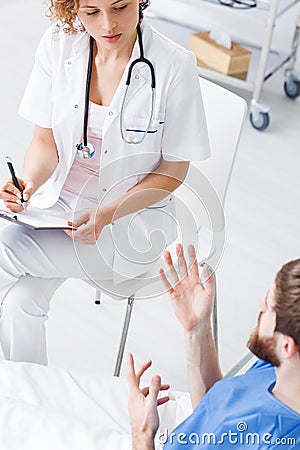 Psychiatric nurse talking with patient Stock Photo