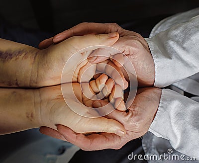 Psychiatrist doctor talking with woman domestic violence victim Stock Photo