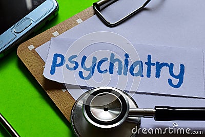 Psychiatry on Healthcare concept with green background Stock Photo