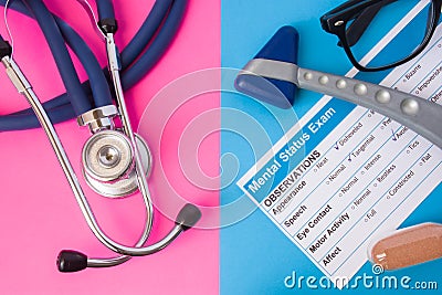 Psychiatry mental status exam, hourglass, reflex hummer and medical stethoscope in two colors background: blue and pink. Concept o Stock Photo