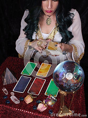 Psychic With Tarot Cards and Crystal Ball Stock Photo