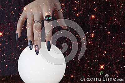 Psychic readings and the concept of clairvoyance. Fortune telling on a crystal ball. Elements of this image furnished by NASA Stock Photo