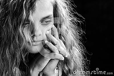 Psychological black and white portrait of a girl on a black background Stock Photo