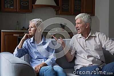 Angry jealous old age husband abuser scold stressed senior wife Stock Photo