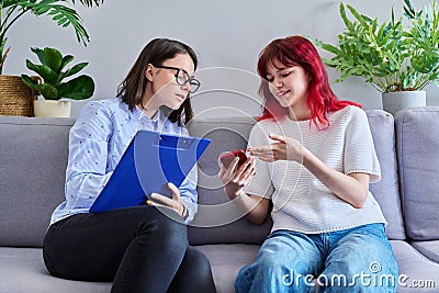 Psychologist counseling teenage female, individual therapy in doctors office. Stock Photo