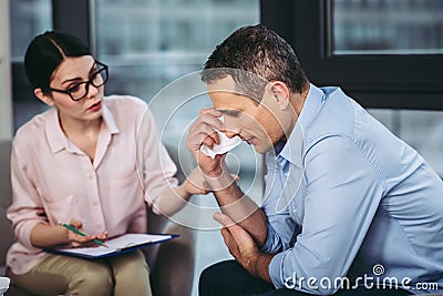 Psychologist talking with patient Stock Photo