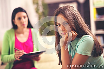 Psychologist treating teenage girl of depression Stock Photo