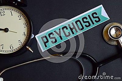 Psychosis on the print paper with Healthcare Concept Inspiration. alarm clock, Black stethoscope. Stock Photo
