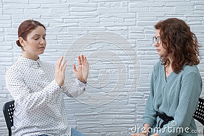 The psychotherapist conducts a hypnosis session. Female patient under hypnosis. Stock Photo