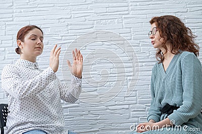 The psychotherapist conducts a hypnosis session. Female patient under hypnosis. Stock Photo