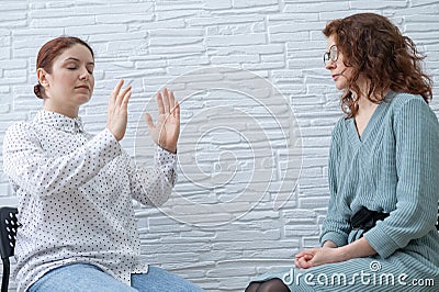 The psychotherapist conducts a hypnosis session. Female patient under hypnosis. Stock Photo