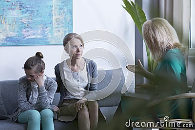 Psychotherapist talking with mother Stock Photo