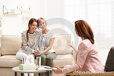 Psychotherapist working with teenage girl and her mother Stock Photo