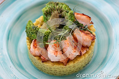 Ptitim with curry sauce shrimp and broccoli. Stock Photo