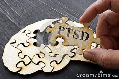 PTSD Post Traumatic Stress written on the puzzle Stock Photo