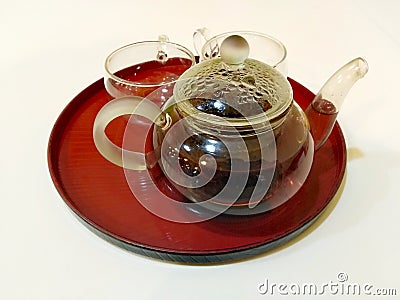 Pu& x27;er tea in pot with teacups Stock Photo
