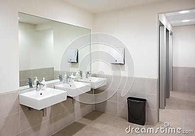 Public bathroom or restroom with hand basins Stock Photo