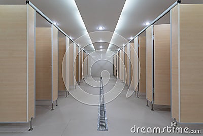 Public building are perspective womans toilets : wooden wall and wooden doors with bright downlight - lavatory design, luxury Stock Photo