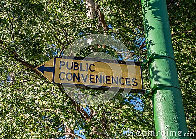 Old Yellow Public Convenience Sign Stock Photo