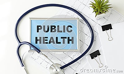 PUBLIC HEALTH CONCEPT Text, On Background of Medicaments Composition, Stethoscope Stock Photo