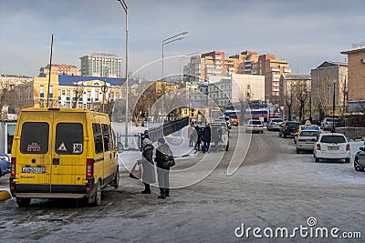 The public minibus and the passengers in front of Ulan-Ude railway station. Editorial Stock Photo